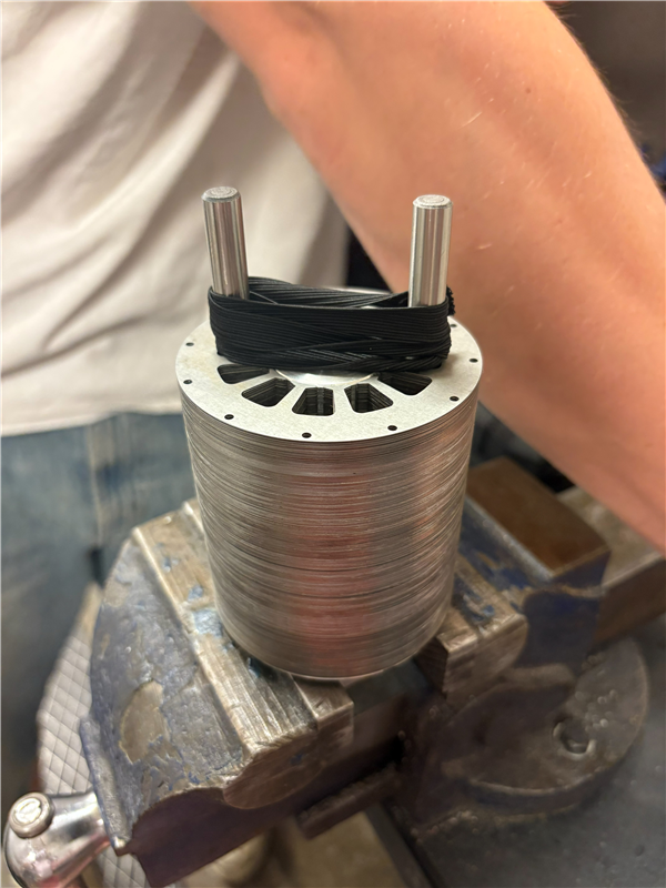 We had the 0.35 mm stator laminations laser cut then stacked and bonded them in-house.